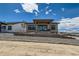 Lovely home features a covered patio and low-maintenance xeriscaped front yard at 400 Basin Daisy St, Castle Rock, CO 80104
