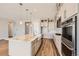 Modern kitchen with stainless steel appliances, large island, and a farmhouse sink at 400 Basin Daisy St, Castle Rock, CO 80104