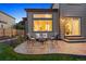 Outdoor patio seating area, great for entertaining with plush seating and lovely lighting all around at 7114 S Acoma Way, Littleton, CO 80120
