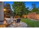 Cozy outdoor patio seating area, great for entertaining with plush seating and lovely lighting all around at 7114 S Acoma Way, Littleton, CO 80120