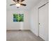 Bedroom with large window, carpeted floor, ceiling fan, and ample natural light, ready for personalization at 7114 S Acoma Way, Littleton, CO 80120