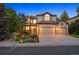 Charming two-story home with landscaped front yard and three-car garage, perfect for Gathering living at 7114 S Acoma Way, Littleton, CO 80120