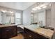 Bathroom with dual sinks, granite countertop and bowl sink at 8174 Dudley Cir, Arvada, CO 80005
