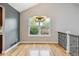 Dining area featuring hardwood floors, a modern light fixture, and large windows overlooking the yard at 8174 Dudley Cir, Arvada, CO 80005