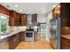 Updated kitchen features stainless steel appliances, granite countertops, and ample cabinet space at 8174 Dudley Cir, Arvada, CO 80005