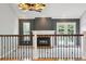 Cozy living area with a fireplace, large windows, and hardwood floors, blending comfort and style at 8174 Dudley Cir, Arvada, CO 80005