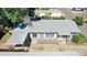 Bird's-eye view of a well-maintained home, featuring a carport and landscaped yard at 9021 Rampart St, Federal Heights, CO 80260