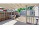 Covered backyard area with a shed and fencing, offering a private outdoor space at 9021 Rampart St, Federal Heights, CO 80260