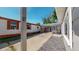 Backyard featuring a carport, storage shed, and low-maintenance gravel landscaping at 9021 Rampart St, Federal Heights, CO 80260