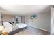 Bedroom featuring neutral wall color, carpeted floors, and a television at 9021 Rampart St, Federal Heights, CO 80260