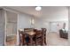 Bright dining space with a table for four, located near the bathroom and living room at 9021 Rampart St, Federal Heights, CO 80260