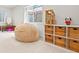 Playroom featuring a beanbag chair, toy shelf, and a window for natural light at 134 S Pontiac St, Denver, CO 80230
