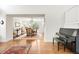 View from the living room into the dining area with elegant furnishings and natural light at 134 S Pontiac St, Denver, CO 80230