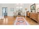 Elegant living room with hardwood floors, neutral decor, and a large window for abundant natural light at 134 S Pontiac St, Denver, CO 80230