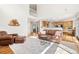 Bright living room features an open floor plan, light colored rug, and comfortable seating at 134 S Pontiac St, Denver, CO 80230