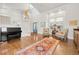 Grand foyer featuring hardwood floors, a staircase, a piano, and decor for a spacious feel at 134 S Pontiac St, Denver, CO 80230