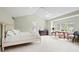 Large main bedroom featuring a vaulted ceiling and a window with wooded views at 134 S Pontiac St, Denver, CO 80230