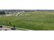 Aerial view of a large park featuring sports fields, playgrounds, and open green spaces at 10252 E 58Th Ave, Denver, CO 80238