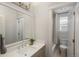 Bright bathroom featuring modern fixtures, a vanity, and a glass-enclosed shower at 10252 E 58Th Ave, Denver, CO 80238