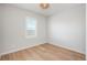 Bright bedroom with hardwood floors and a window providing natural light at 10252 E 58Th Ave, Denver, CO 80238
