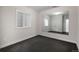 Empty bedroom with a window, closet, and large mirror at 10252 E 58Th Ave, Denver, CO 80238