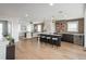 Spacious living area featuring a bar, brick accent wall, and ample seating at 10252 E 58Th Ave, Denver, CO 80238
