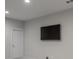 Minimalist living room featuring a blank wall and a door at 10252 E 58Th Ave, Denver, CO 80238
