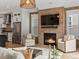 Beautiful living room with modern fireplace, recessed lighting, and stainless steel appliances at 10252 E 58Th Ave, Denver, CO 80238