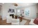 Home office with fireplace, natural light, and stylish furnishings at 10252 E 58Th Ave, Denver, CO 80238
