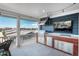 Well-equipped outdoor kitchen with stainless steel appliances and a view of the neighborhood at 10252 E 58Th Ave, Denver, CO 80238