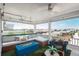 Outdoor patio with a seating area featuring a blue fire pit and views of the surrounding neighborhood at 10252 E 58Th Ave, Denver, CO 80238
