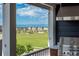 Breathtaking view from the rooftop deck overlooking a green space and city skyline at 10252 E 58Th Ave, Denver, CO 80238