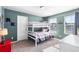 Cozy bedroom with green walls and a bunk bed, perfect for  at 944 Black Saddle St, Elizabeth, CO 80107