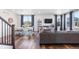 Open concept dining area with hardwood floors and a farmhouse table at 944 Black Saddle St, Elizabeth, CO 80107