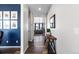 Modern entryway with dark hardwood floors and a console table at 944 Black Saddle St, Elizabeth, CO 80107