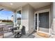 Inviting front porch with seating for two, creating a welcoming entryway at 944 Black Saddle St, Elizabeth, CO 80107