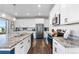 Modern kitchen with granite countertops, stainless steel appliances, and hardwood floors at 944 Black Saddle St, Elizabeth, CO 80107