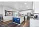 Modern kitchen featuring a large island, stainless steel appliances, and hardwood floors at 944 Black Saddle St, Elizabeth, CO 80107