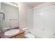 Bathroom featuring a vanity with sink, mirror, tile flooring, toilet and shower over tub at 11862 W Stanford Pl, Morrison, CO 80465