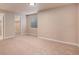 Bedroom featuring neutral carpet, a window with blinds, and access to the closet and hallway at 11862 W Stanford Pl, Morrison, CO 80465