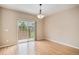 Dining room with hardwood floors and sliding glass door, allowing for seamless indoor-outdoor living and natural light at 11862 W Stanford Pl, Morrison, CO 80465