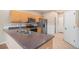 Functional kitchen with stainless steel appliances, ample counter space, and tiled floors for easy maintenance at 11862 W Stanford Pl, Morrison, CO 80465