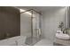 Bright bathroom featuring a glass enclosed shower, a soaking tub, and double vanity at 314 Galapago St, Denver, CO 80223