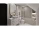 Bright bathroom featuring a shower-tub combo, toilet, and vanity at 314 Galapago St, Denver, CO 80223