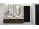 Bright bathroom featuring a double vanity with oval mirrors and stone countertops at 314 Galapago St, Denver, CO 80223