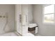 Bright bathroom featuring a shower-tub combo, toilet, and vanity at 314 Galapago St, Denver, CO 80223