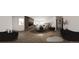 Modern bedroom with a large window, TV, platform bed, and minimalist decor at 314 Galapago St, Denver, CO 80223