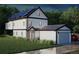 Rear view of a modern home featuring solar panels, a garage, and a spacious lawn in a verdant setting at 314 Galapago St, Denver, CO 80223