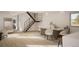 Inviting living room featuring a staircase, hardwood flooring, and a dining area, all bathed in natural light at 314 Galapago St, Denver, CO 80223