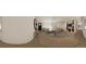Spacious living room with hardwood floors, a modern sofa, and a fireplace at 314 Galapago St, Denver, CO 80223